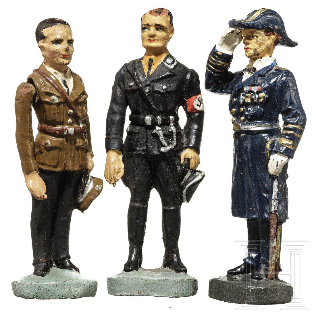 Three Elastolin personality figures - Rudolf Hess in: Three Elastolin personality figures - Rudolf Hess in black uniform, Joseph Goebbels in party uniform and Admiral Erich RaederElastolin, 7 cm-Serie, 30er Jahre, Masseausführung. Hess in schwarzer SS-U