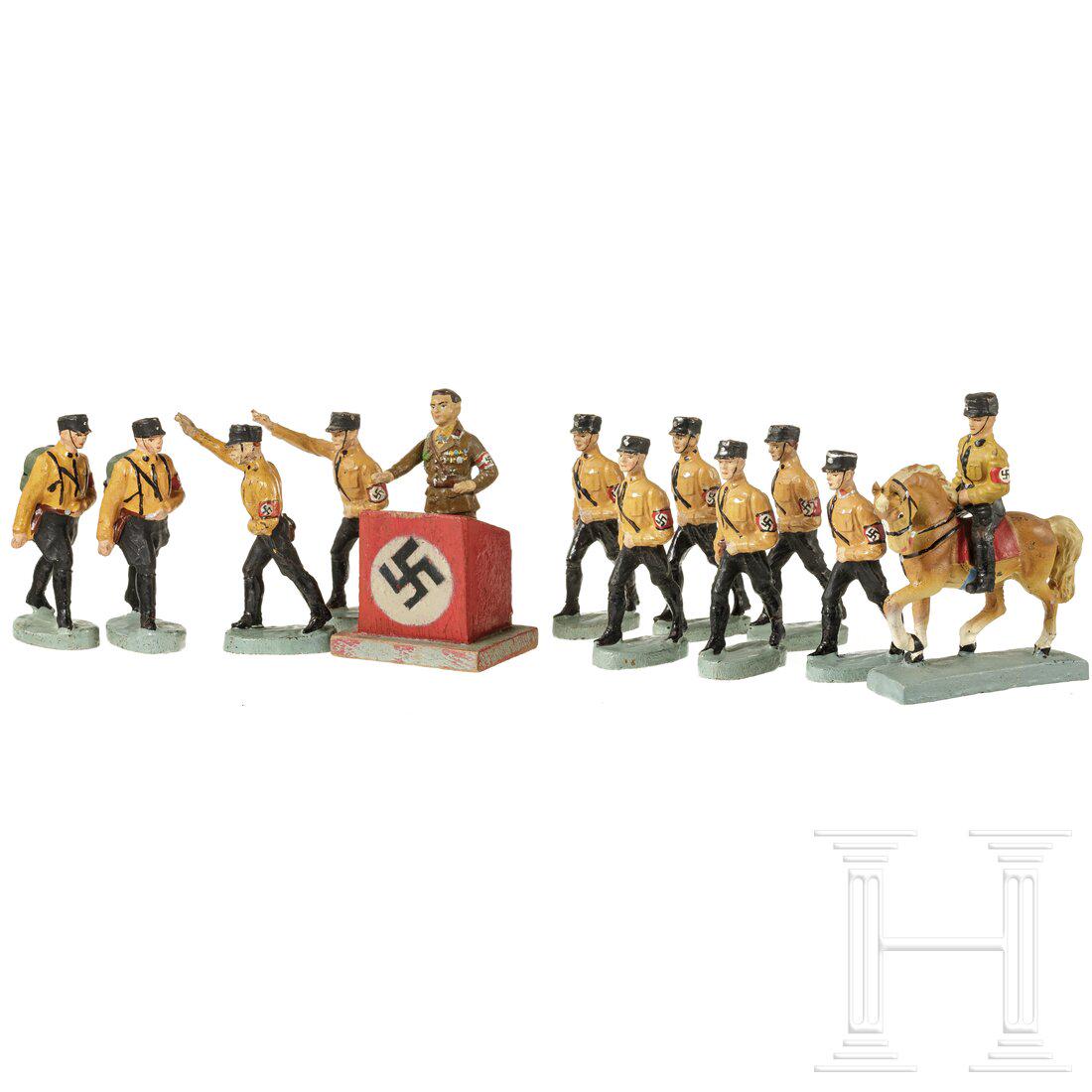 Eleven Elastolin and Lineol SS figures marching in: Eleven Elastolin and Lineol SS figures marching in brown shirt and Hermann Goering in party uniform Elastolin, Masseausführung, 7 cm-Serie, 30er Jahre. Zwölf politische Figuren, SS im Braunhemd, dab