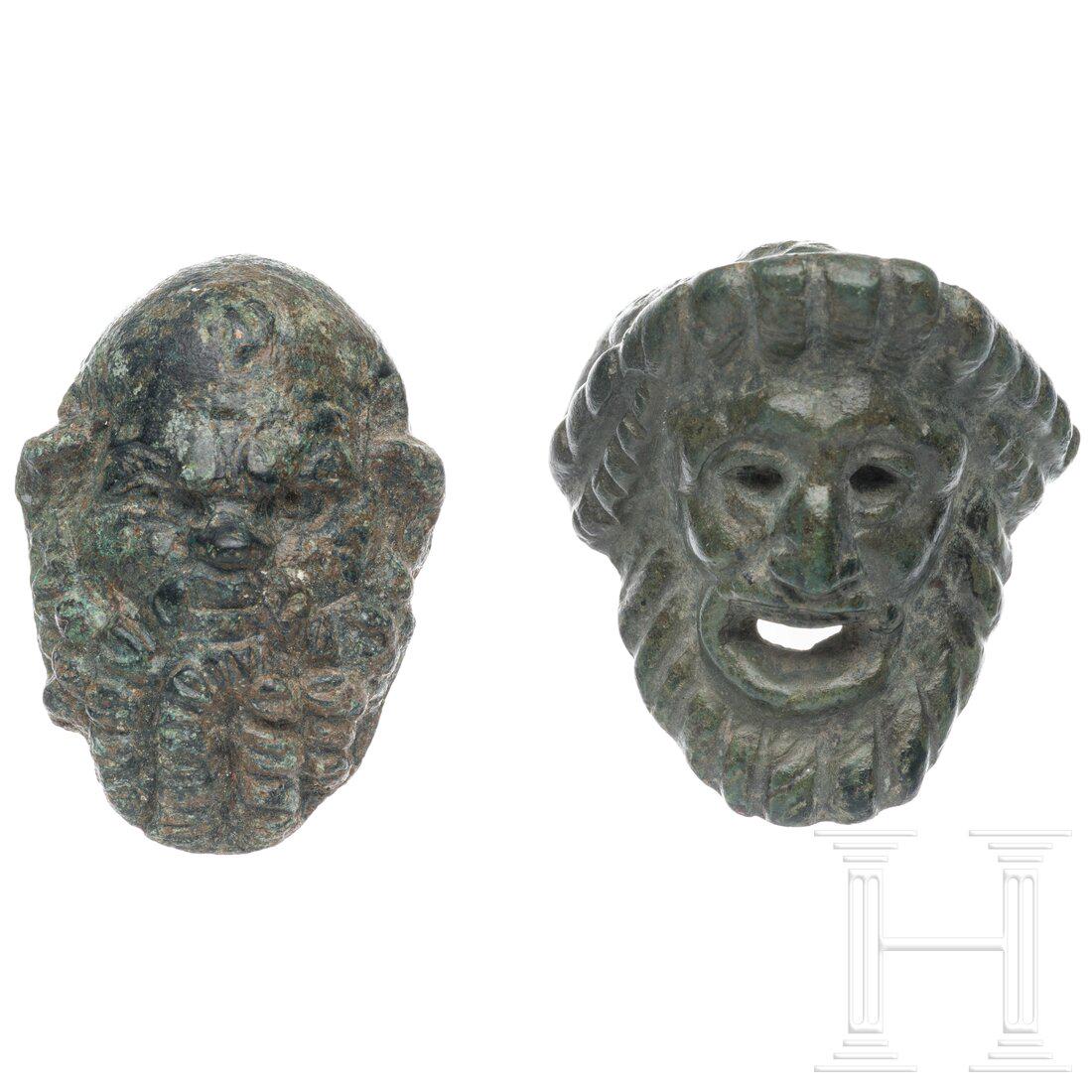 Two Roman head appliqués, 2nd - 3rd century: Two Roman head appliqués, 2nd - 3rd century Two bronze appliqués, one in the form of a theatre mask, the other showing a bearded silen with a snub nose. Intact. Excellent patina. Length 4 cm
