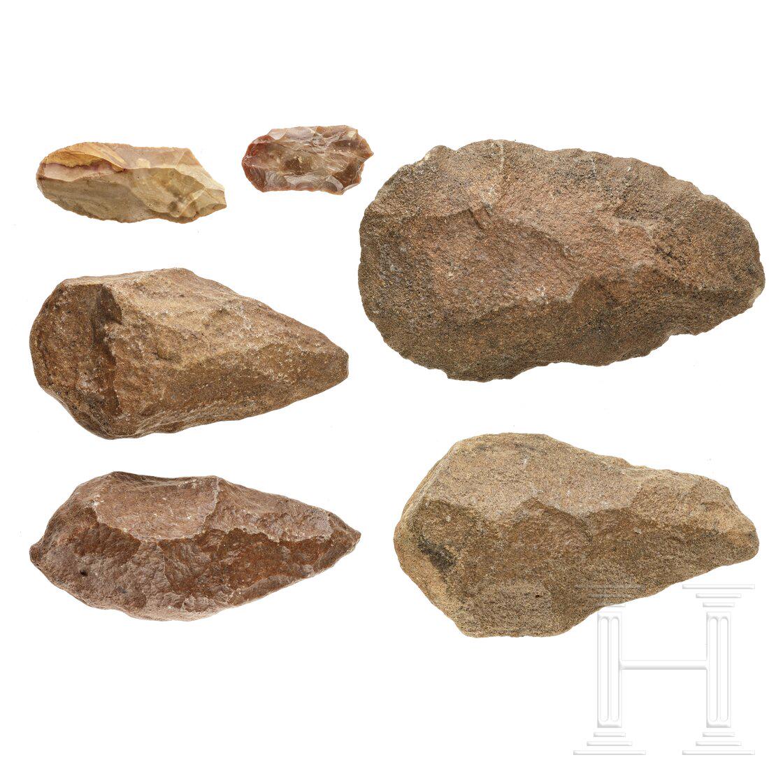 Six Palaeolithic stone tools, 100,000 - 10,000 B.C.: Six Palaeolithic stone tools, 100,000 - 10,000 B.C. Four Palaeolithic bifaces made of rock. Beautiful age patina. Length 13 - 17 cm. In addition two drills made of beige flint, one of them produced in