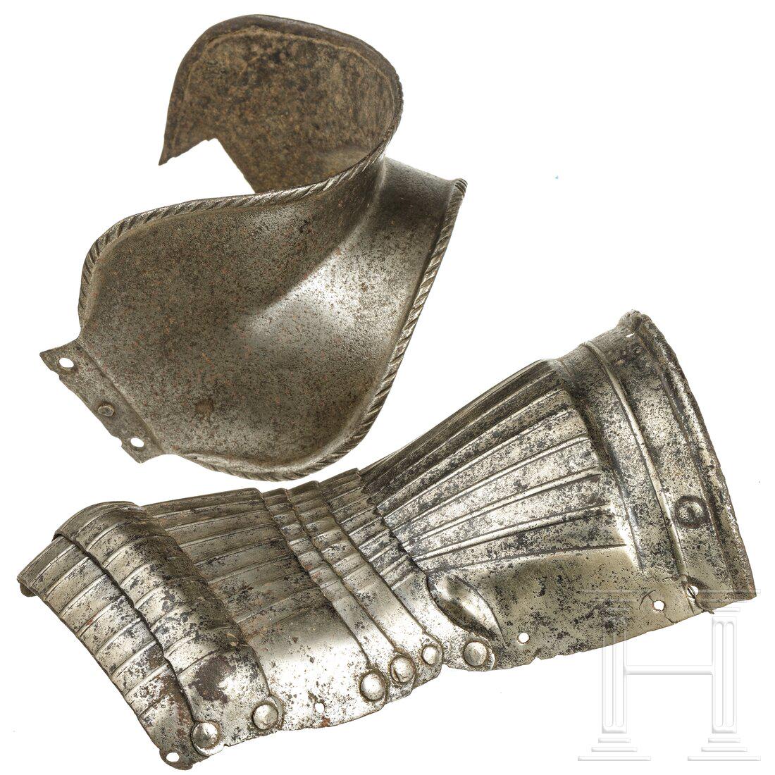 A German Maximilian gauntlet and fragment of a couter, (1 of 3)