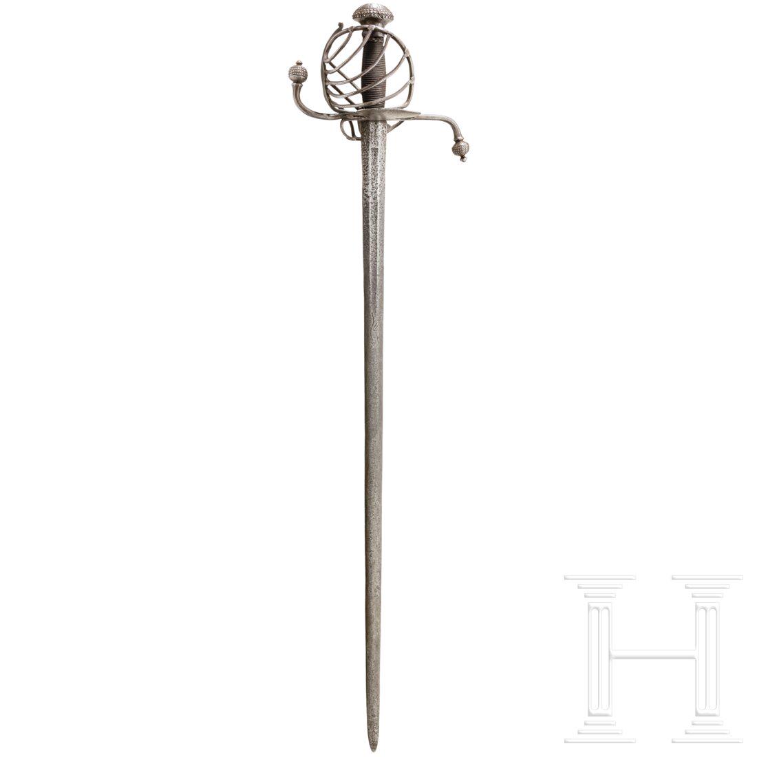 A Styrian basket-hilted sword, circa 1600: A Styrian basket-hilted sword, circa 1600 Double-edged blade, the base on both sides with flat fullers and engraved with stylised Passau wolf mark. Swept dussack-type basket hilt with S-shaped quillon