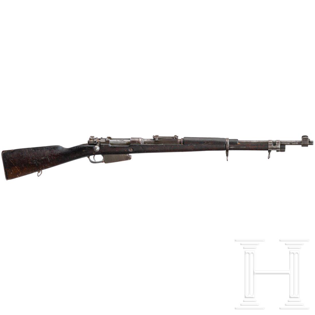 Kurzgewehr Mod. 1889/39: Kurzgewehr Mod. 1889/39Cal. 7,65x53Arg, SN. 1204D, nicht nummerngleich. Lauf matt. Fünfschüssig. ELG-Beschuss. Hülsenkopf gemarkt "Anc. Etabts Pieper / Herstal". Originale Brünieru