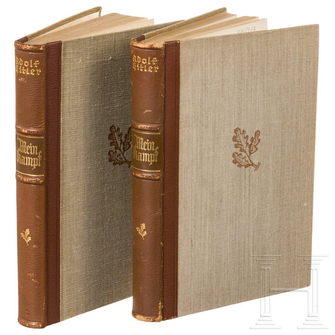 Mein Kampf in two volumes: "Mein Kampf" in two volumesHalbleinen mit braunem Lederrücken (bestoßen) und Goldprägung, oberseitiger Goldschnitt, Zentralverlag 1940. 360 bzw. 351 Seiten. Das Vorsatzblatt mit Geschen
