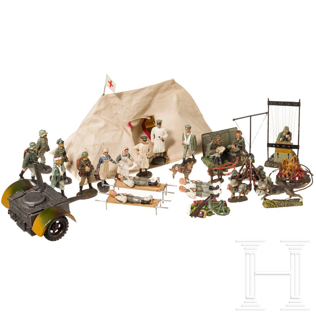An Elastolin and Lineol group with 16 figures and accessories, a Field Kitchen 845 and a Red Cross: An Elastolin and Lineol group with 16 figures and accessories, a Field Kitchen 845 and a Red Cross Tent 5/306Hausser-Elastolin/Lineol, Blech-Masse-Stoffausführung, 7 cm-Serie. Dabei eine Lineol F