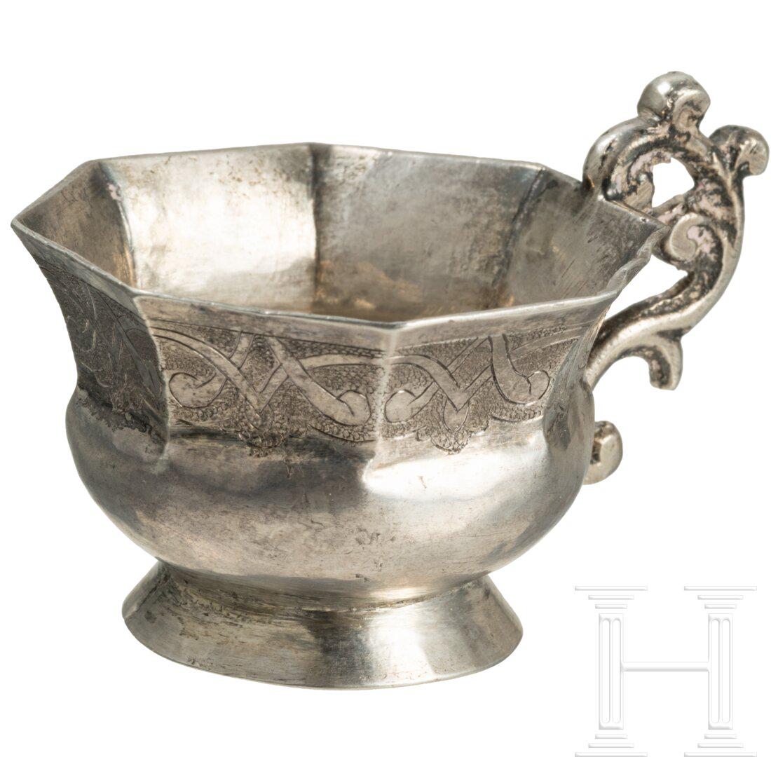 A Russian silver charka, Moscow, dated 1842: A Russian silver charka, Moscow, dated 1842Round base. Upper part of the octagonal body with engraved foliage on stippled ground. Bottom with coin with Cyrillic inscription and date "Empress Elisabeth