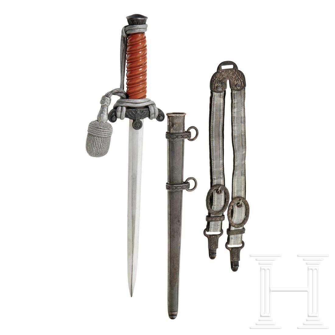 A Model 1935 Dagger for Heer Officer: A Model 1935 Dagger for Heer Officer Maker F.W. Holler, Solingen, polished steel blade with etched motto and manufacturerâ€™s trademark on reverse, silver-plated cross-guard and pommel, orange ce