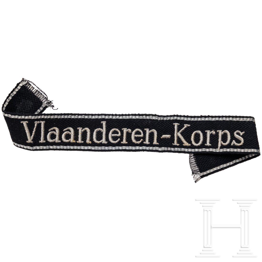 A "Vlaanderen-Korps" cuff title for EM/NCOs: A "Vlaanderen-Korps" cuff title for EM/NCOsÃ„rmelband in schwarz gewebter deutscher RZM-AusfÃ¼hrung mit silbergrau eingestickter Aufschrift in lateinischer Schrift und eingewebten silbernen Rands
