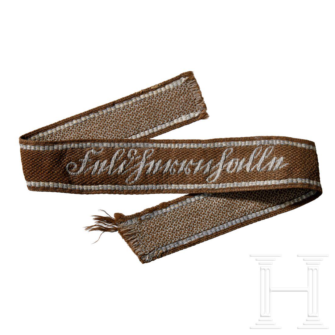 A cuff title â€œFeldherrnhalleâ€: A cuff title â€œFeldherrnhalle”Machine woven, tan rayon construction, repeating, interwoven, waffle pattern and machine, "BeVo", woven, SÃ¼tterlin style script "Feldherrnhalle" in silvery/
