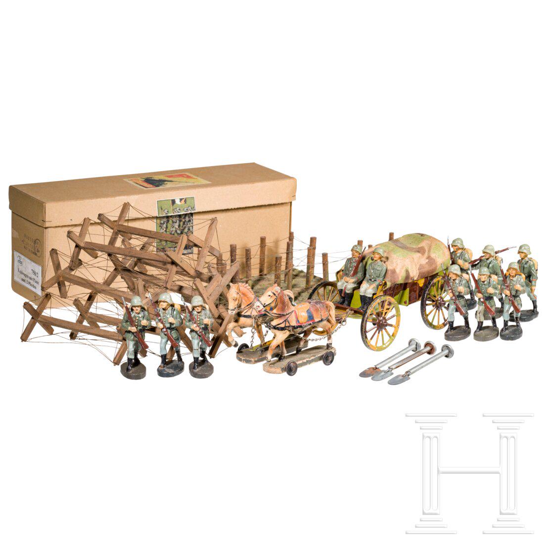 A Hausser-Elastolin horse drawn Field Wagon 750/2, nine advancing Elastolin soldiers, nine: A Hausser-Elastolin horse drawn Field Wagon 750/2, nine advancing Elastolin soldiers, nine anti-cavalry blockades and two trench piecesHausser-Elastolin, Blech-MasseausfÃ¼hrung, 30er Jahre, 7 cm-Ser