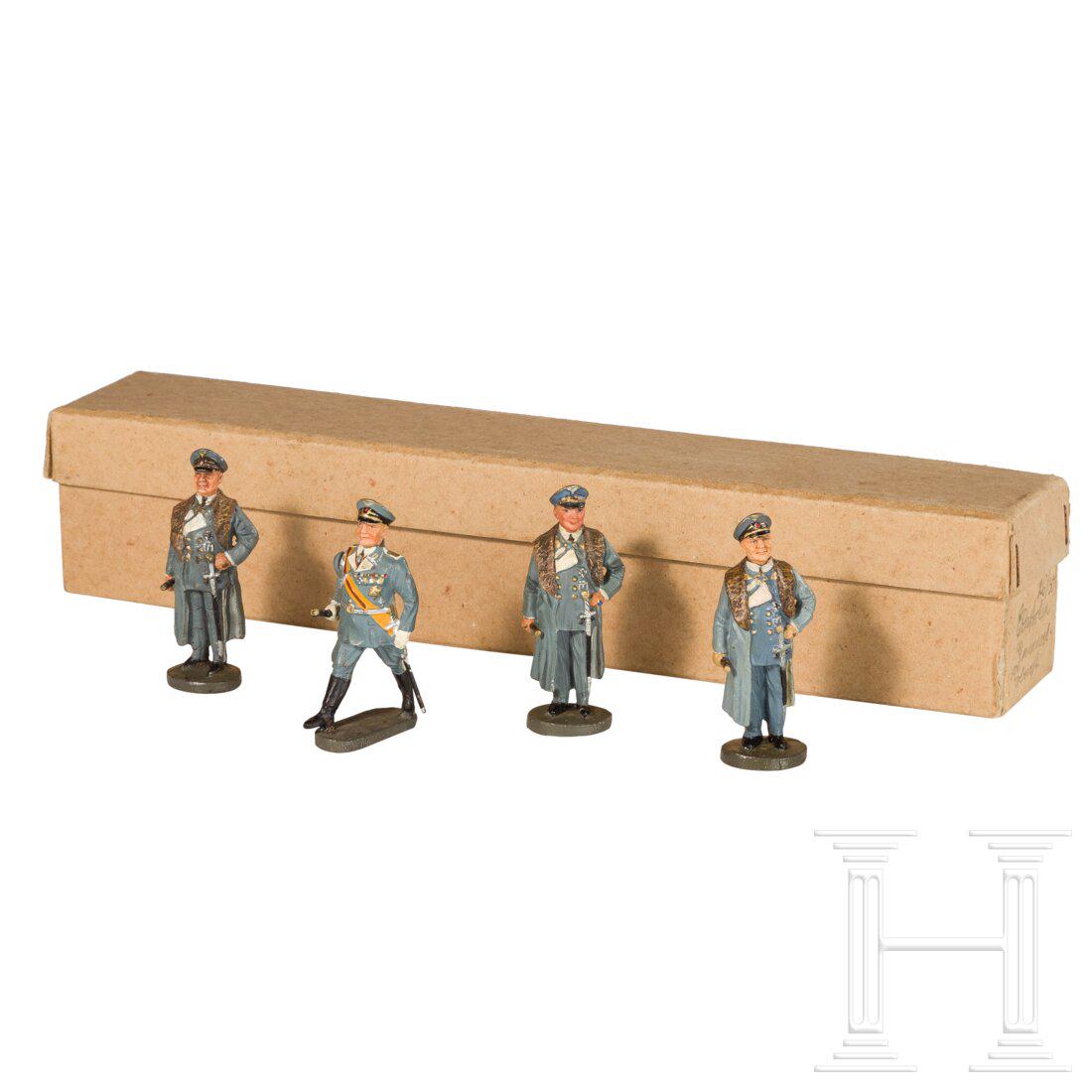 Four Hermann GÃ¶ring personality figures with porcelain heads: Four Hermann GÃ¶ring personality figures with porcelain headsHausser-Elastolin, MasseausfÃ¼hrung, 30er Jahre, 7 cm-Serie. Vier PersÃ¶nlichkeitsfiguren mit Porzellankopf, drei davon von Hermann G