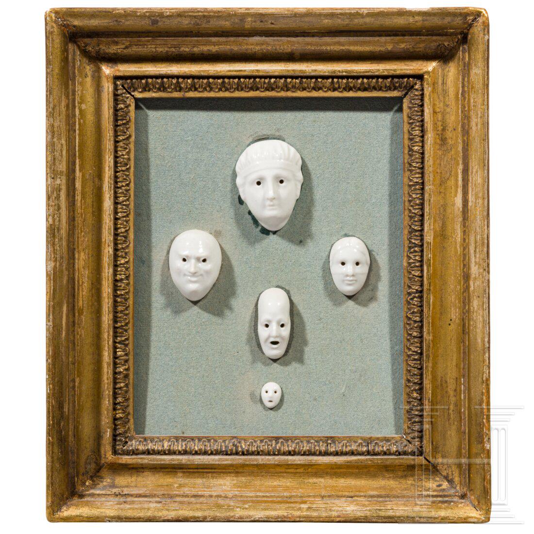 A set of five porcelain masks designed by August GÃ¶hring (1891 - 1965), mounted in carved and (1 of 4)