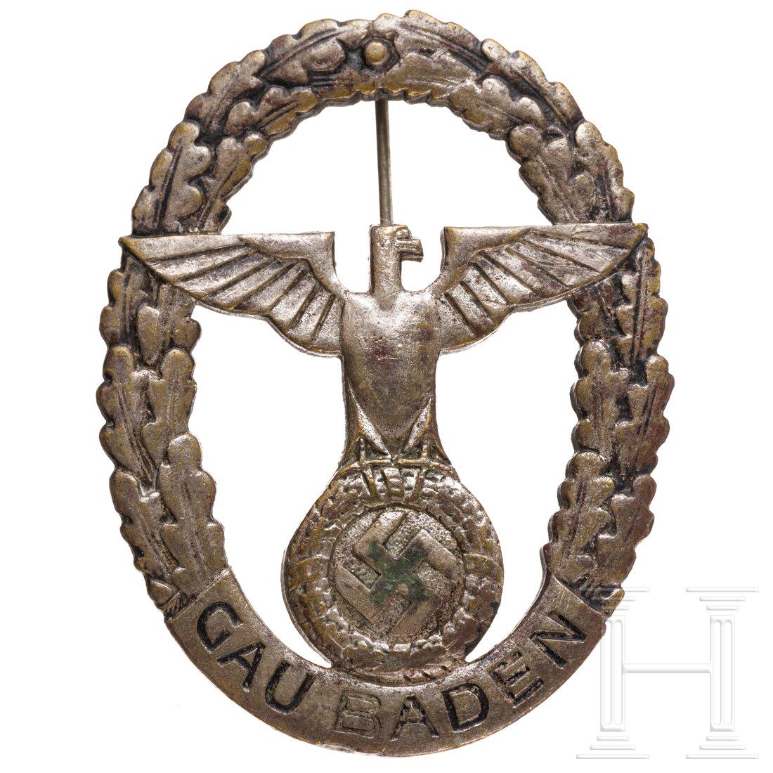 A Gau Baden commemorative badge in silver for men: A Gau Baden commemorative badge in silver for menOvales, einteilig geprÃ¤gtes, versilbertes, durchbrochenes Abzeichen mit rs. dÃ¼nner Drahtnadel und Herstellerpunzierung "Fr. Plett Karlsruhe". Ged