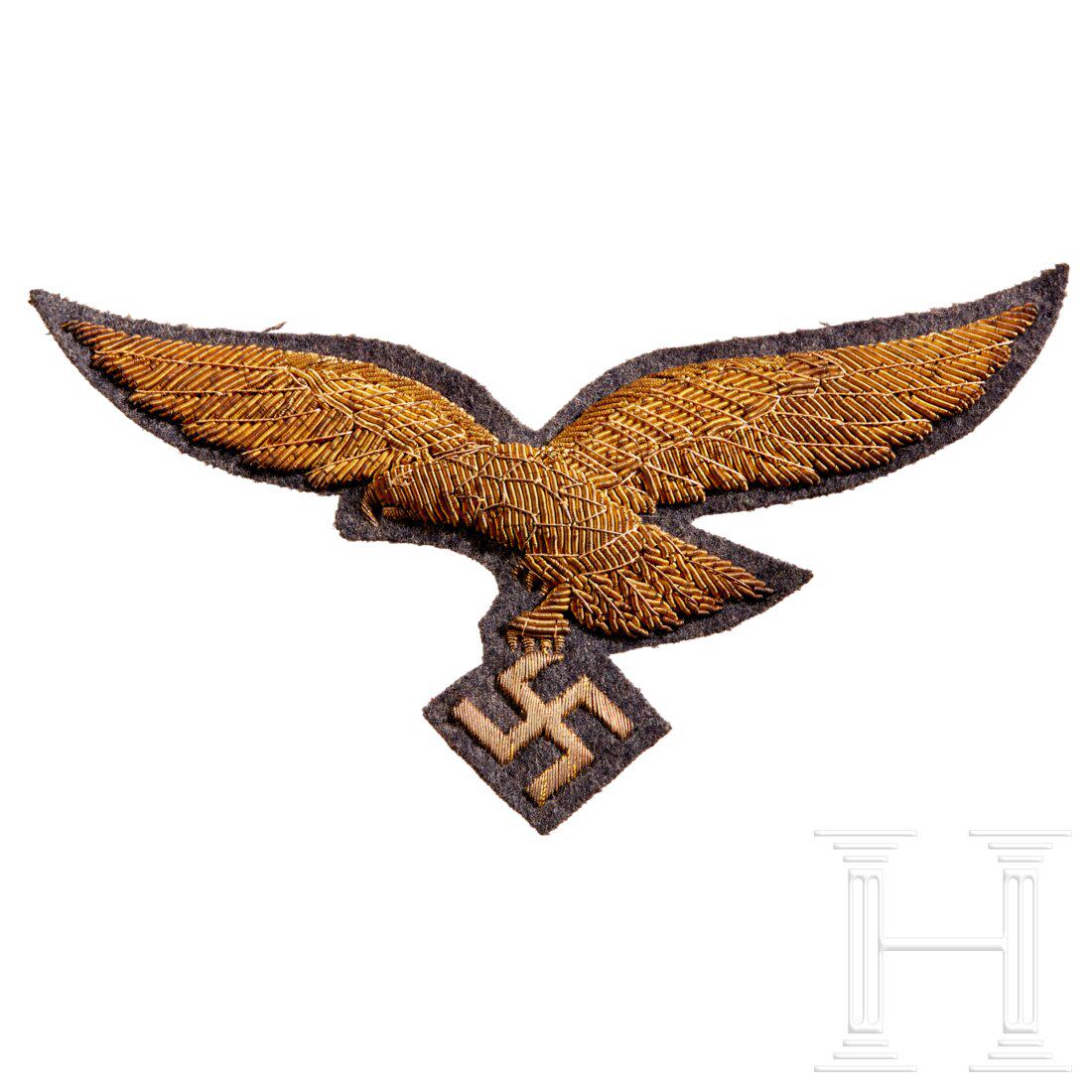 A Cape Eagle for a General: A Cape Eagle for a GeneralLarge, right facing, hand-embroidered in gold metallic wire thread over blue-grey cloth underlay, black paper backing intact. For use on the officerâ€™s cape. Wingspan c