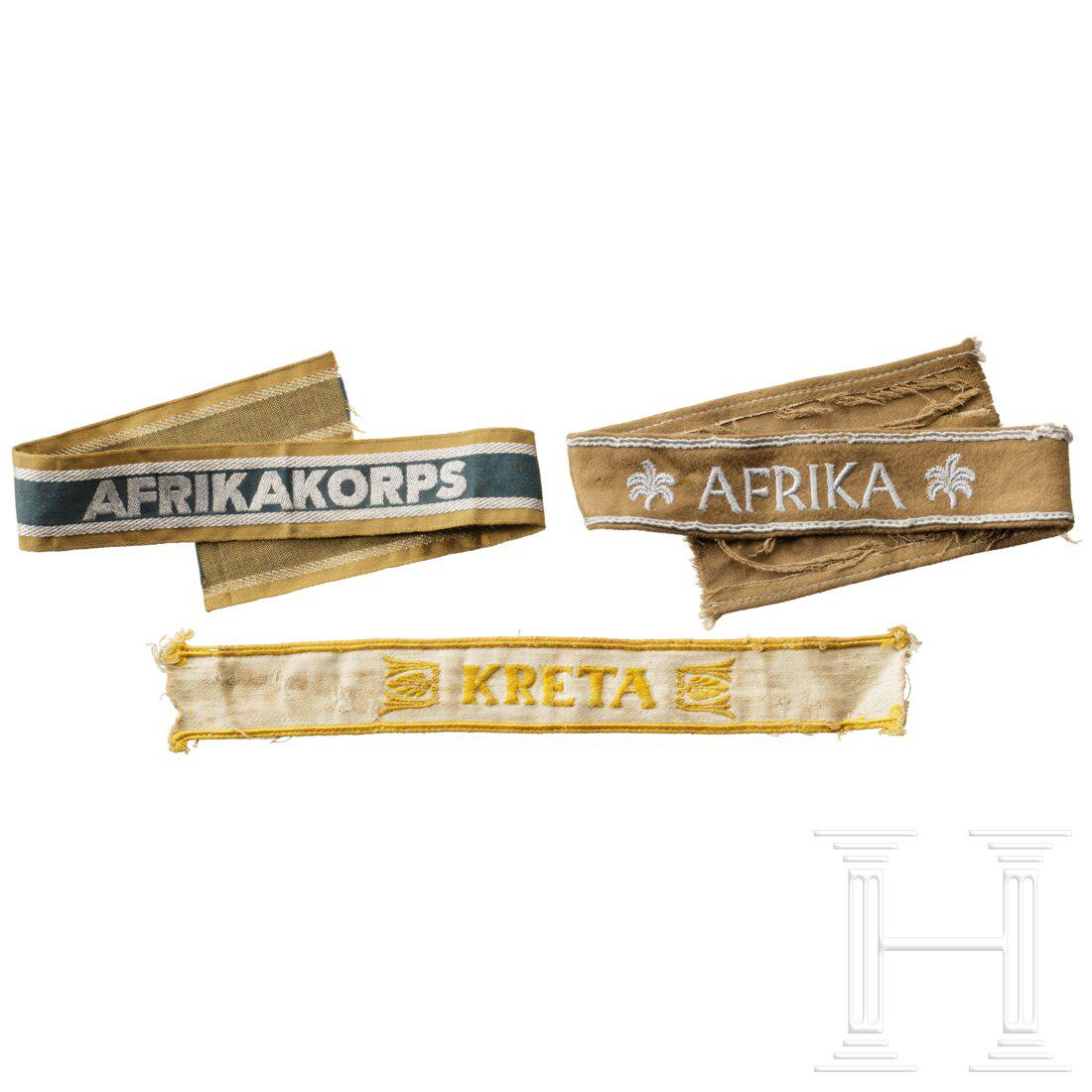 Three cuff titles: Three cuff titlesÃ„rmelband "Afrika" in sog. "KamelhaarausfÃ¼hrung" mit mattgrauer Stickerei und Einfassungslitzen auf hellbraunem Grund. Ã„rmelband "Kreta" (gekÃ¼rzt) mit goldgelber Sticker