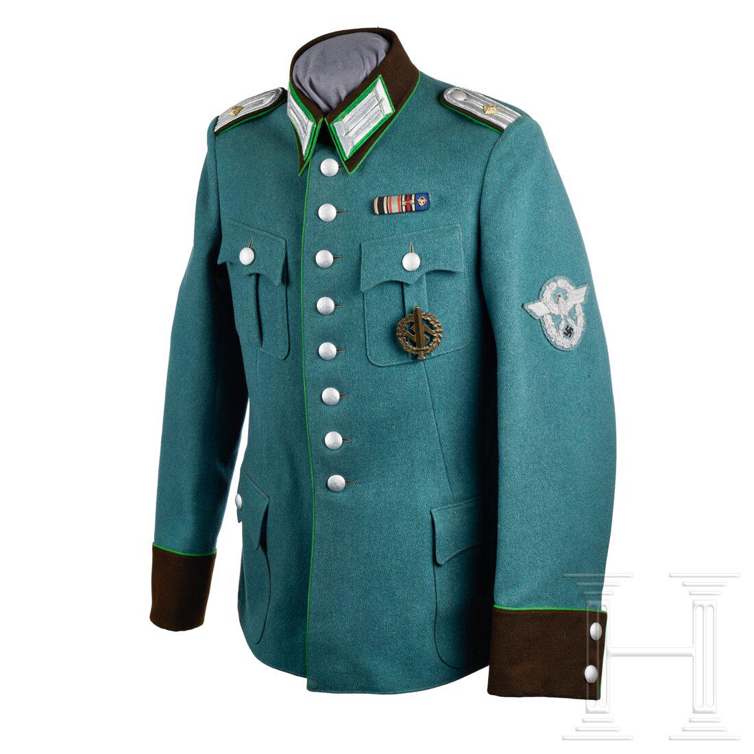 A Schupo Officer Tunic: A Schupo Officer TunicPolice-green tricot wool, privately tailored, scalloped and pleated breast and hip pockets, eight-button front, brown badge cloth collar with double hook closure, front panel, co