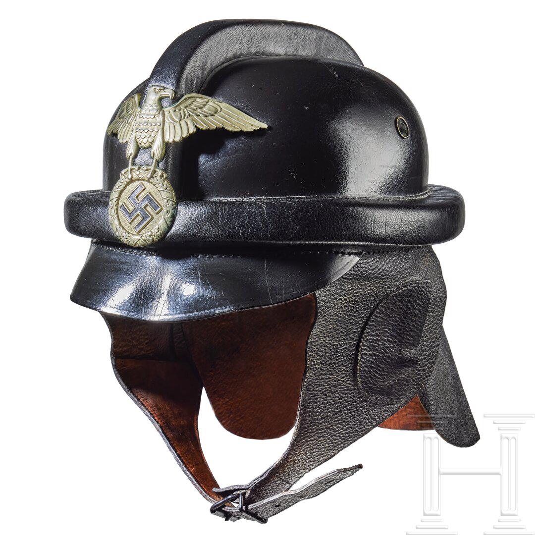 A 1st Pattern Crash Helmet for NSKK: A 1st Pattern Crash Helmet for NSKKVulcan fiber, black leather-covered body, single ventilation on each side, black leather padded protective roll across top and around side, black leather visor, silv