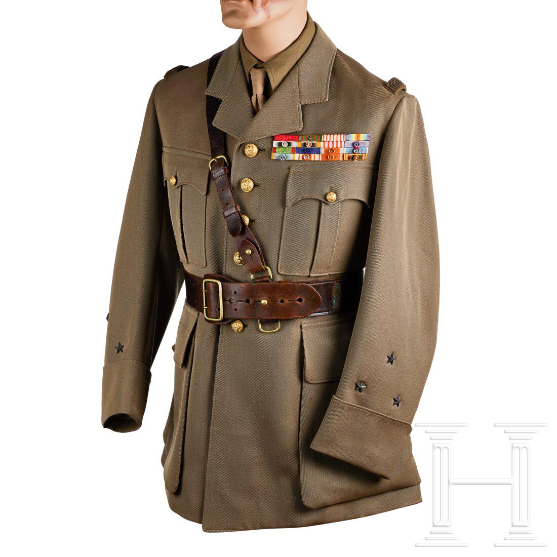 A French General Service Tunic: A French General Service TunicKhaki ribbed tricot cloth, open collar, four-button front, breast pockets with scallops and pleats, waist pockets with straight flaps, gilt finish buttons, French cuffs. 