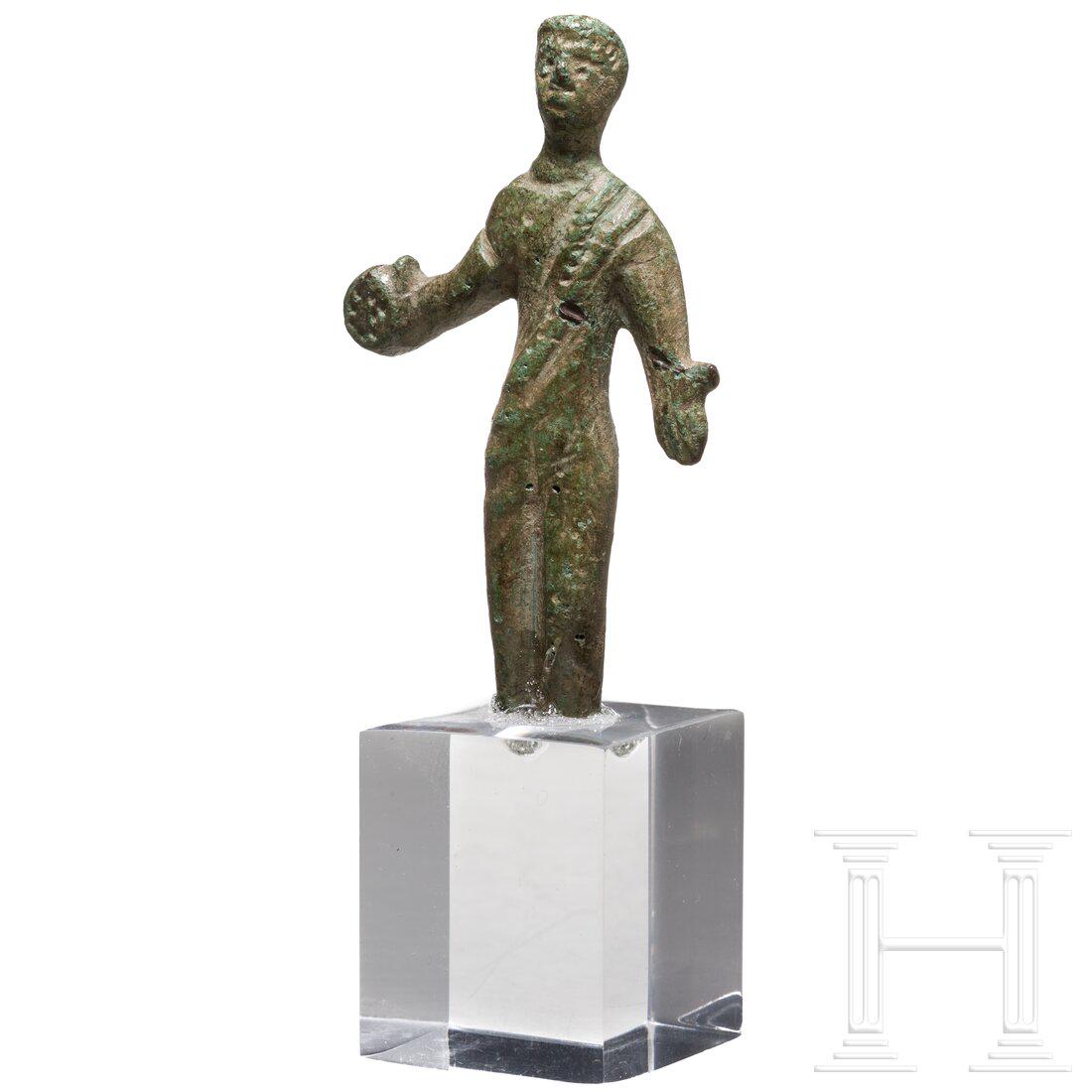 An Etruscan bronze votive statuette of a sacrificing man, 5th - 3rd century B.C. (1 of 3)