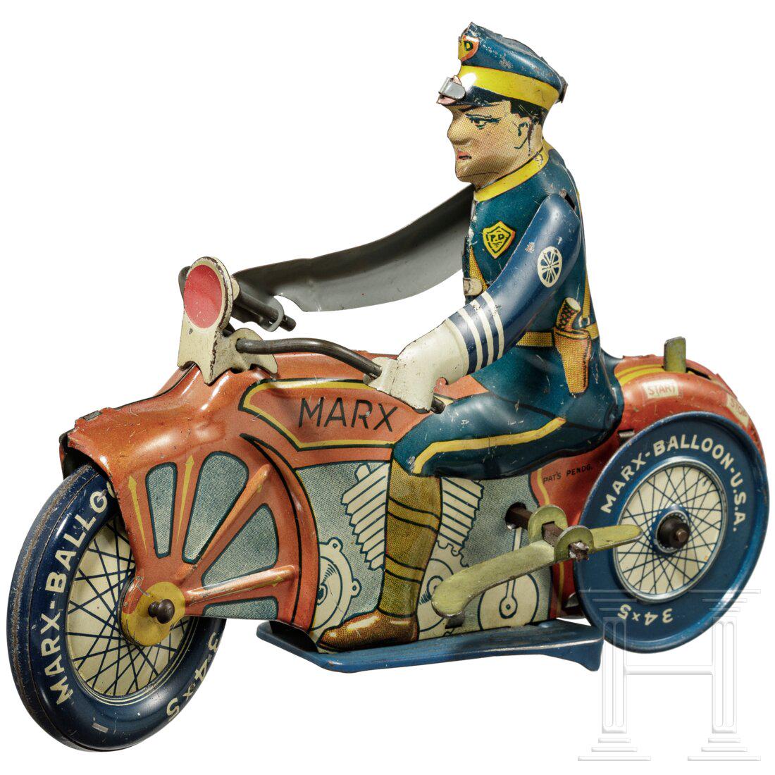 A Marx Toys motorcycle policeman with windup key (1 of 5)