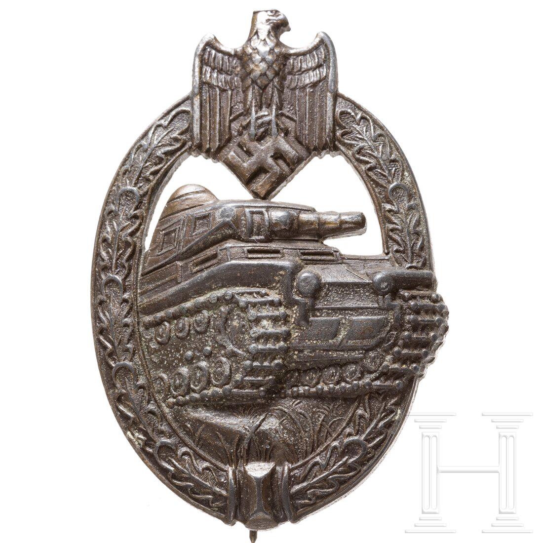 A Panzer assault badge in bronze, made by AS: A Panzer assault badge in bronze, made by ASHalbhohle bronzierte (gedunkelt) FeinzinkausfÃ¼hrung mit rs. vertikaler Drahtnadel und dem AS-Dreieckslogo des unbekannten Herstellers.Condition: II