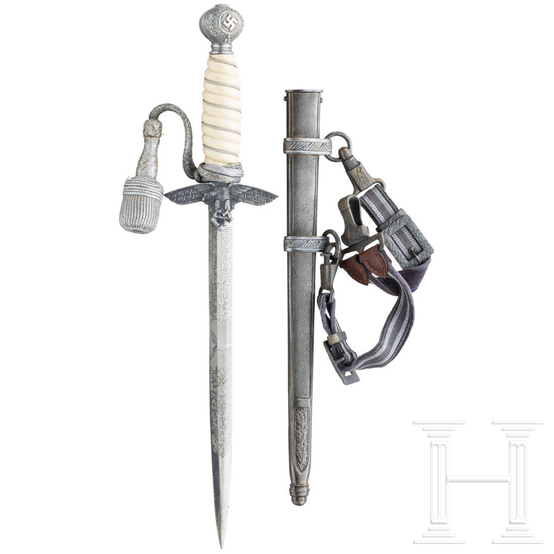 An air force officer's dagger M 37: An air force officer's dagger M 37Aus Alt- und Neuteilen zusammengestellt (assembled from original and replica parts), u.a. mit einer Replicaklinge. Komplett mit GehÃ¤nge. LÃ¤nge ca. 37 cm. Das Ha