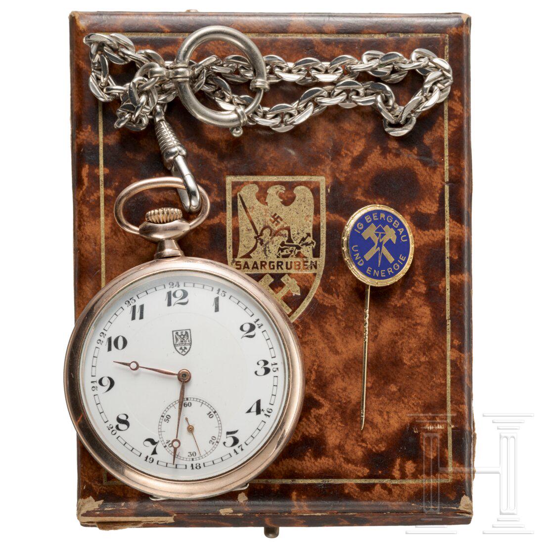 A cased present pocket watch from the Prussian coal mine company "Saargruben": A cased present pocket watch from the Prussian coal mine company "Saargruben"Silberne, teils vergoldete Taschenuhr mit Widmungsgravur "FÃ¼r langjÃ¤hrige treue Mitarbeit - Saargruben-Aktiengesellsc