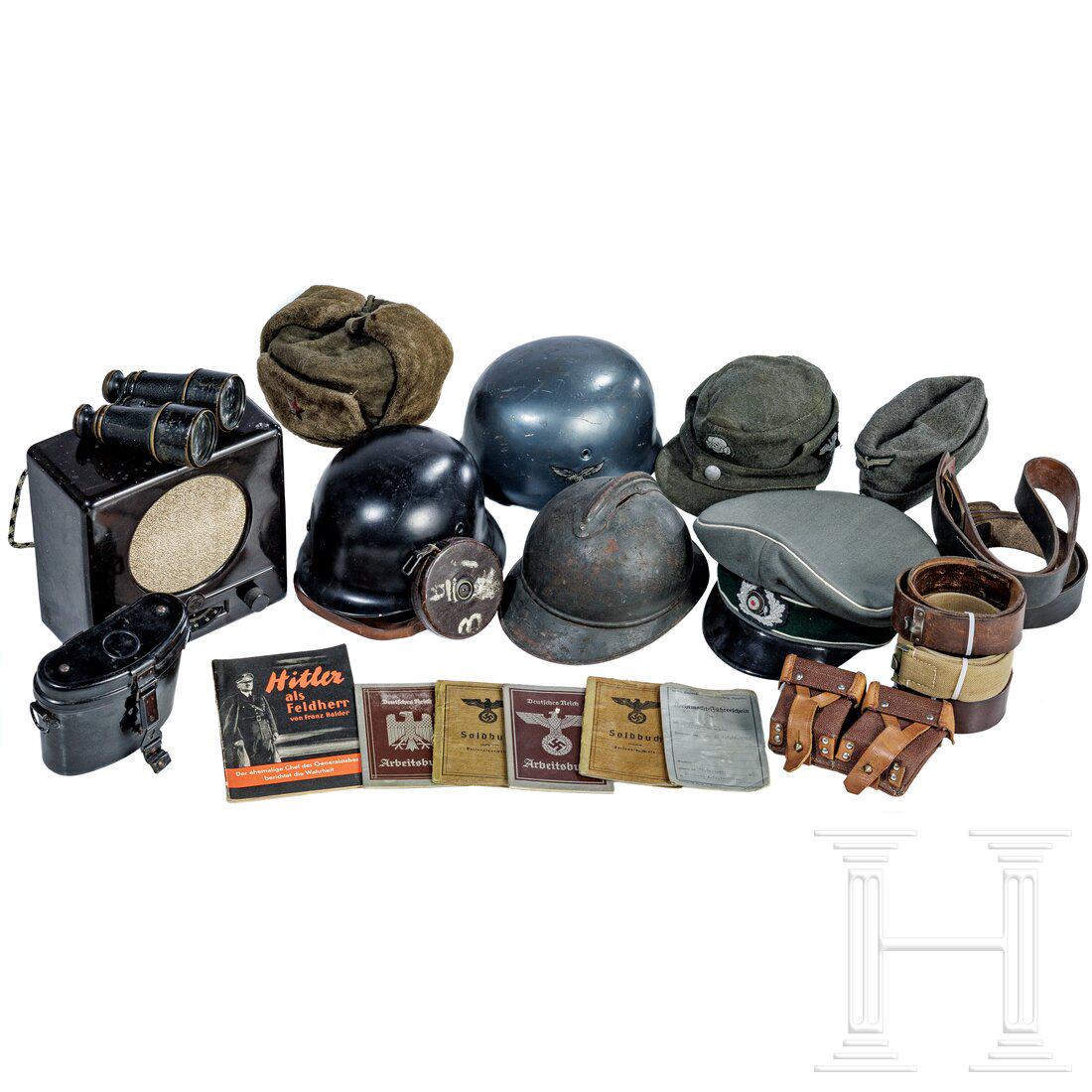 A group of militaria: A group of militariaZwei grob Ã¼berarbeitete, nachlackierte Glocken des Stahlhelmes M 40 und eines BGS-Helmes, eine Glocke des franzÃ¶sischen Adrianhelmes M 15, ein FernglaskÃ¶cher aus Bakelit, 