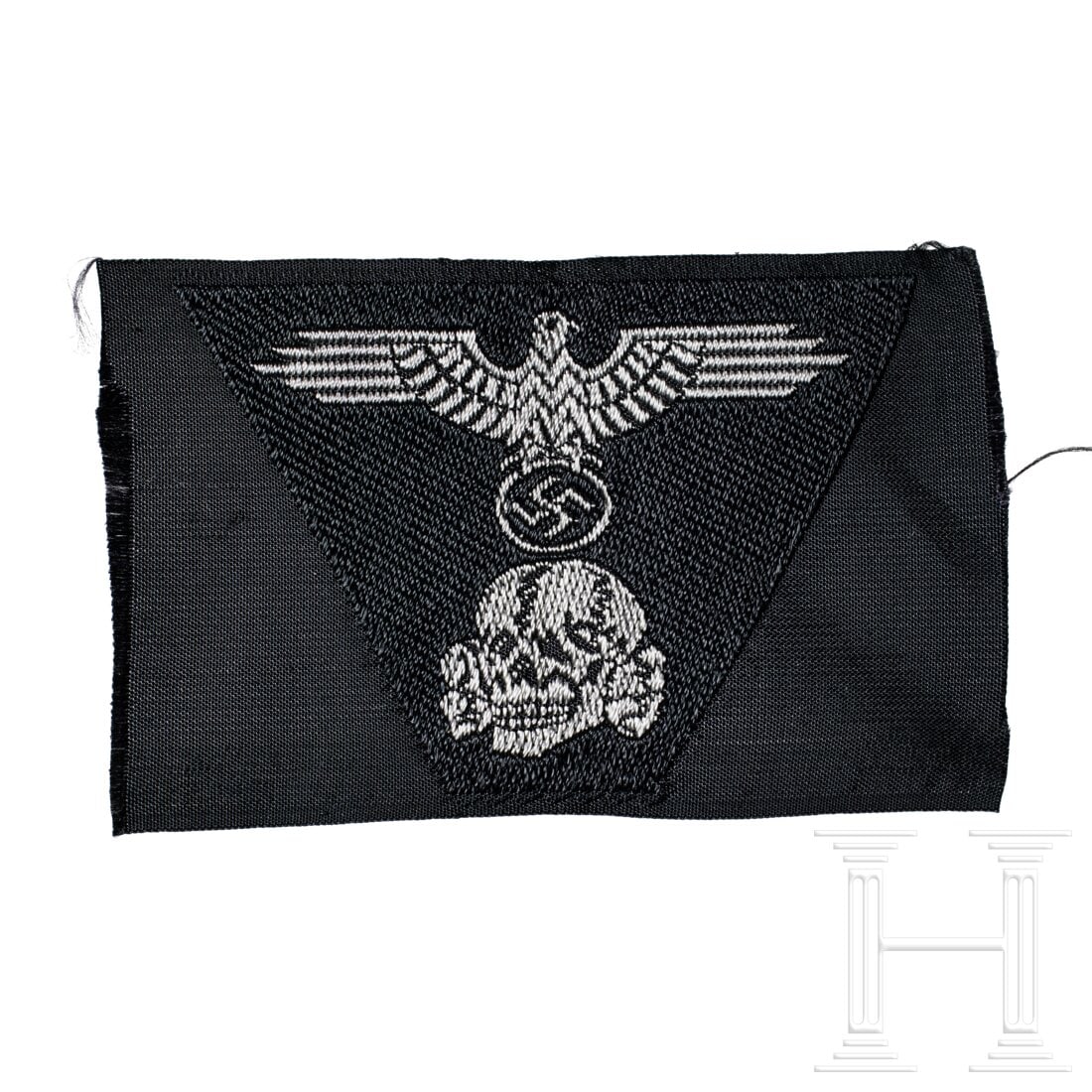 A SS One-Piece Trapezoid Panzer Cap Insignia: A SS One-Piece Trapezoid Panzer Cap InsigniaSilver-grey thread, machine-woven eagle and skull on black rayon backing, unissued.USA lot - more info hereCondition: II