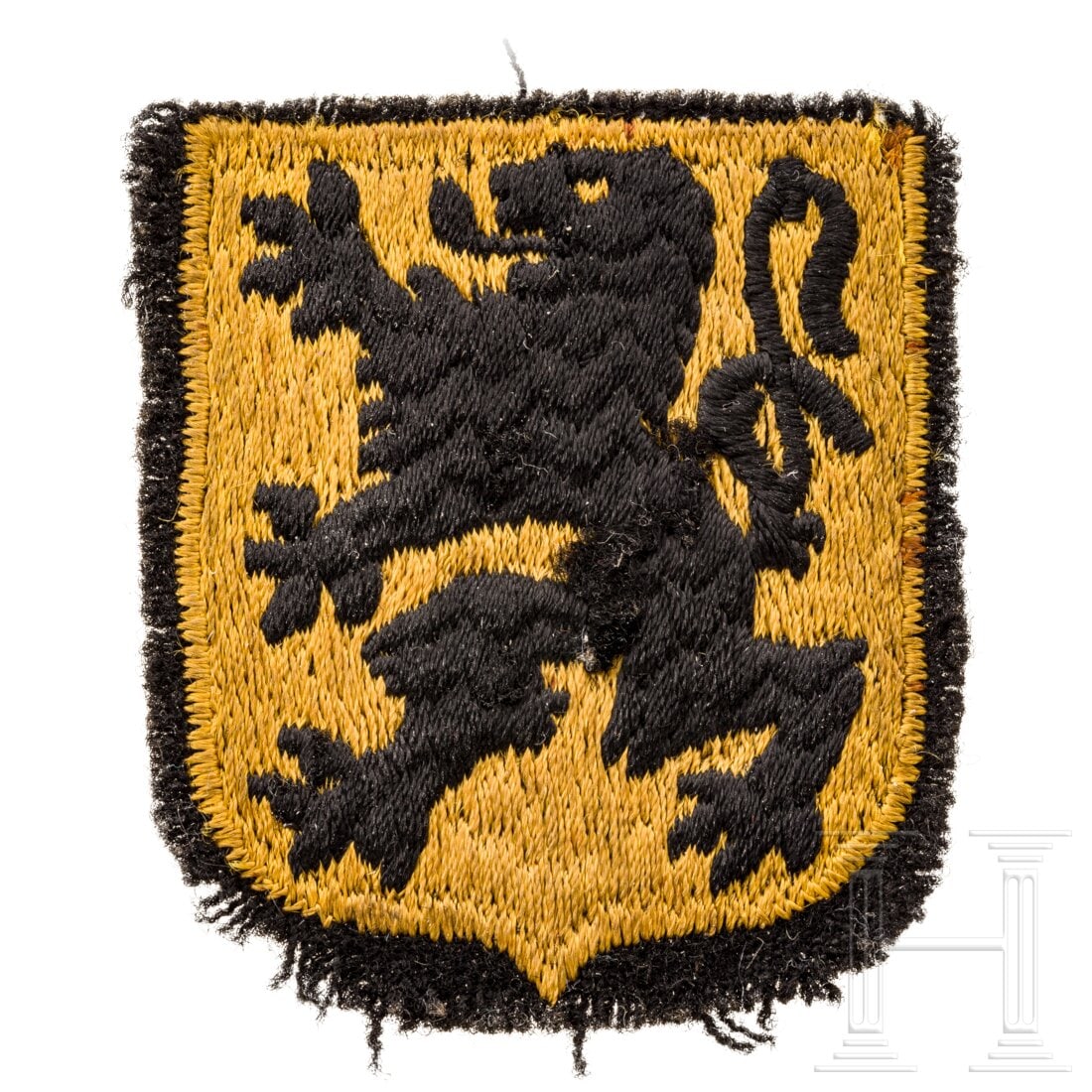 A sleeve badge for Flemish volunteers: A sleeve badge for Flemish volunteersDeutsche RZM-Fertigung, das schwarze Abzeichen mit schwarz gesticktem LÃ¶wen auf einem gelben Schild. Die RÃ¤nder ausgefranst, MaÃŸe ca. 5,5 x ,5 cm. Conditi