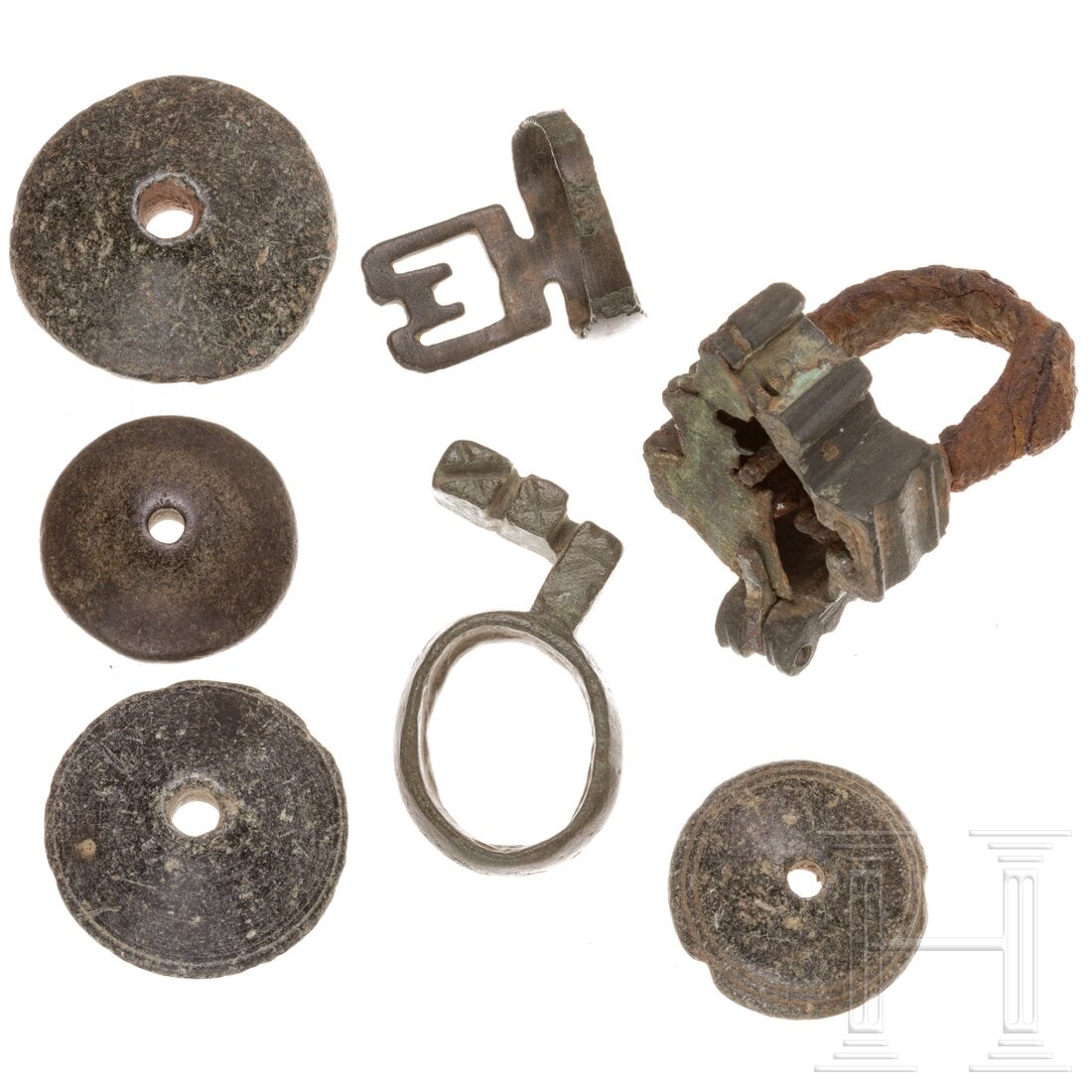 Four Roman spindle whorls made of stone, two rings with keys and a padlock mechanism, 1st - 3rd (1 of 2)