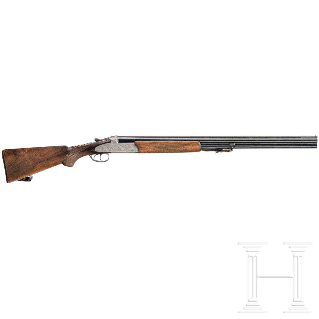 An over-and-under shotgun Kettner, Mod. Acciaio: An over-and-under shotgun Kettner, Mod. AcciaioCal. 12/70, SN. 14754, Unterer Lauf im ersten Drittel rau. Choke 3/4. Oberer Lauf blank. Choke 1/1. Lauflänge 72 cm. Italienischer Beschuss. Guillochier