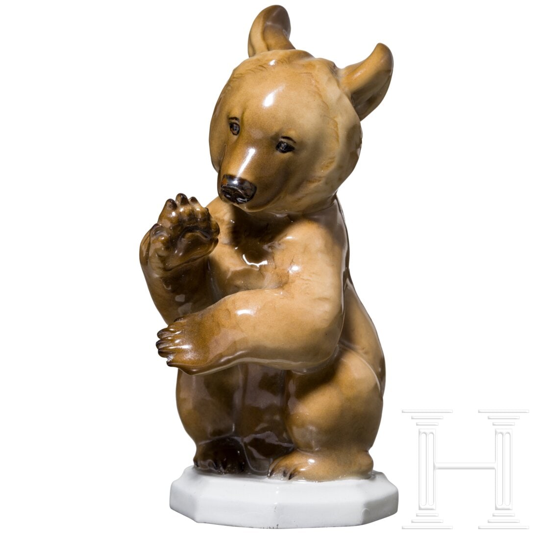 Porcelain Manufactory Allach - a coloured figurine of a begging bear: Porcelain Manufactory Allach - a coloured figurine of a begging bearFarbig gefasste Porzellanfigur nach einem Entwurf von Prof. Theodor Kärner. Im Boden grüne Manufakturmarke "SS Allach" im reliefie