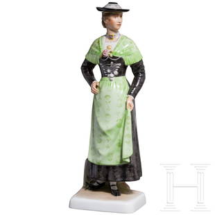 Porcelain Manufactory Allach - a coloured figurine of an Upper Bavarian peasant woman: Porcelain Manufactory Allach - a coloured figurine of an Upper Bavarian peasant womanFarbig gefasste Porzellanfigur nach einem Entwurf von Richard Förster, darstellend eine Bäuerin in traditioneller