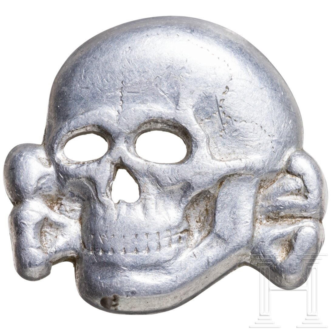 A metal death's head for caps (1 of 3)