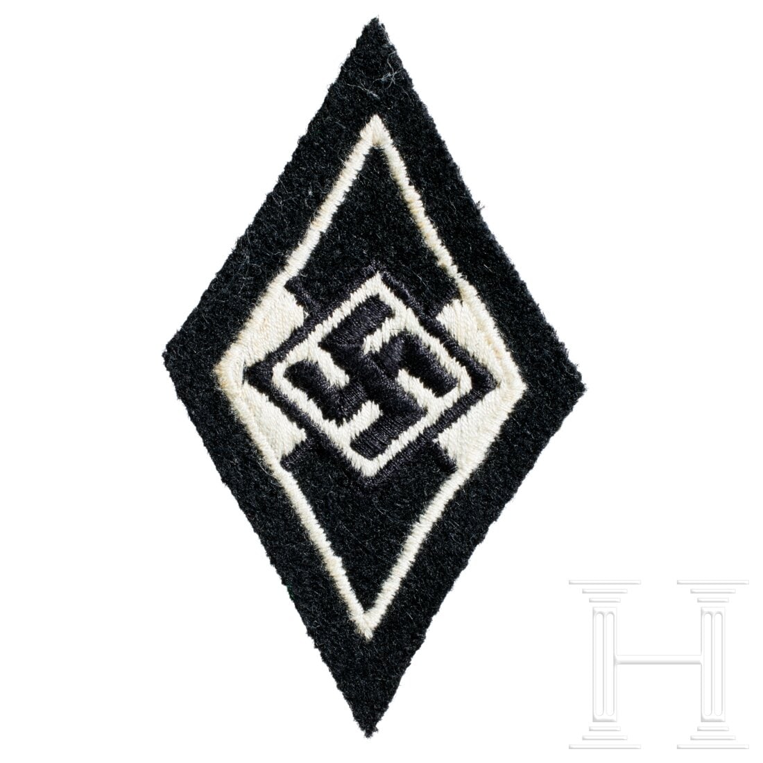 A Sleeve Diamond for Former Members of the Hitler Youth: A Sleeve Diamond for Former Members of the Hitler YouthBlack cloth backing, white machine-embroidered Hitler Youth triangle. USA lot - more info hereCondition: I -