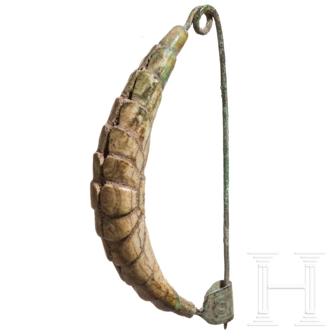 A bow brooch with bone cladding and Etruscan inscription, 7th century B.C.: A bow brooch with bone cladding and Etruscan inscription, 7th century B.C.Wire-shaped bow brooch with coiled pin at top and flat hammered, U-shaped, folded catch-plate at bottom. The entire bow encase