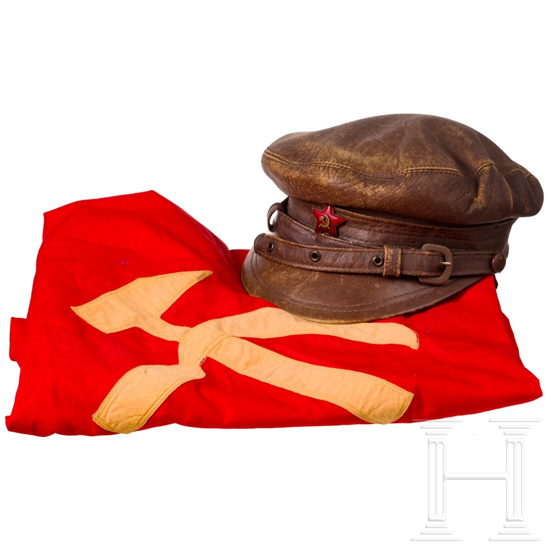 A Soviet leather peaked cap and red flag with Soviet symbolism, 1925 - 1960 (1 of 6)