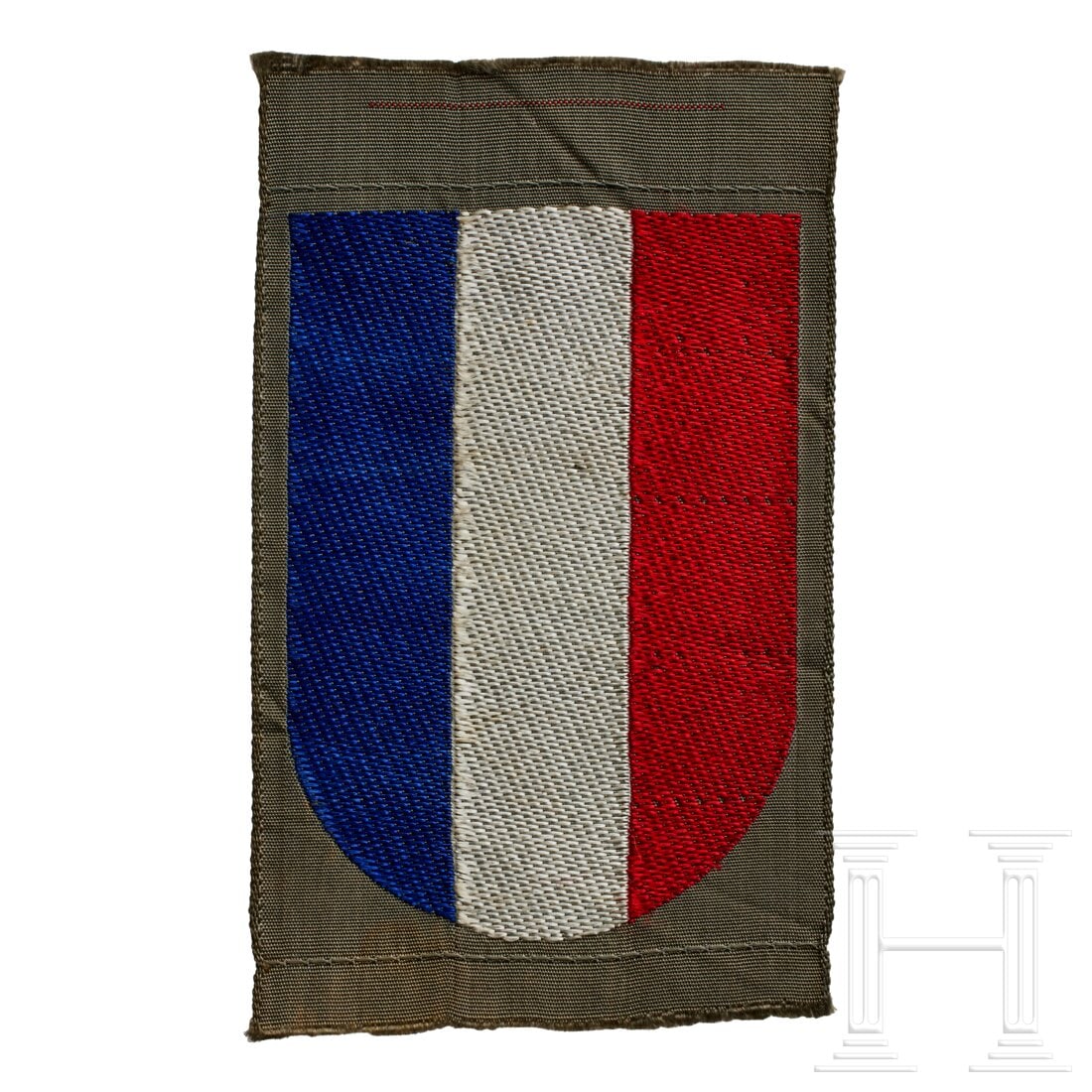 An Arm Shield for French Volunteers: An Arm Shield for French VolunteersField-grey rayon base, machine-woven shield of blue/white/red vertical stripes.USA lot - more info hereCondition: II