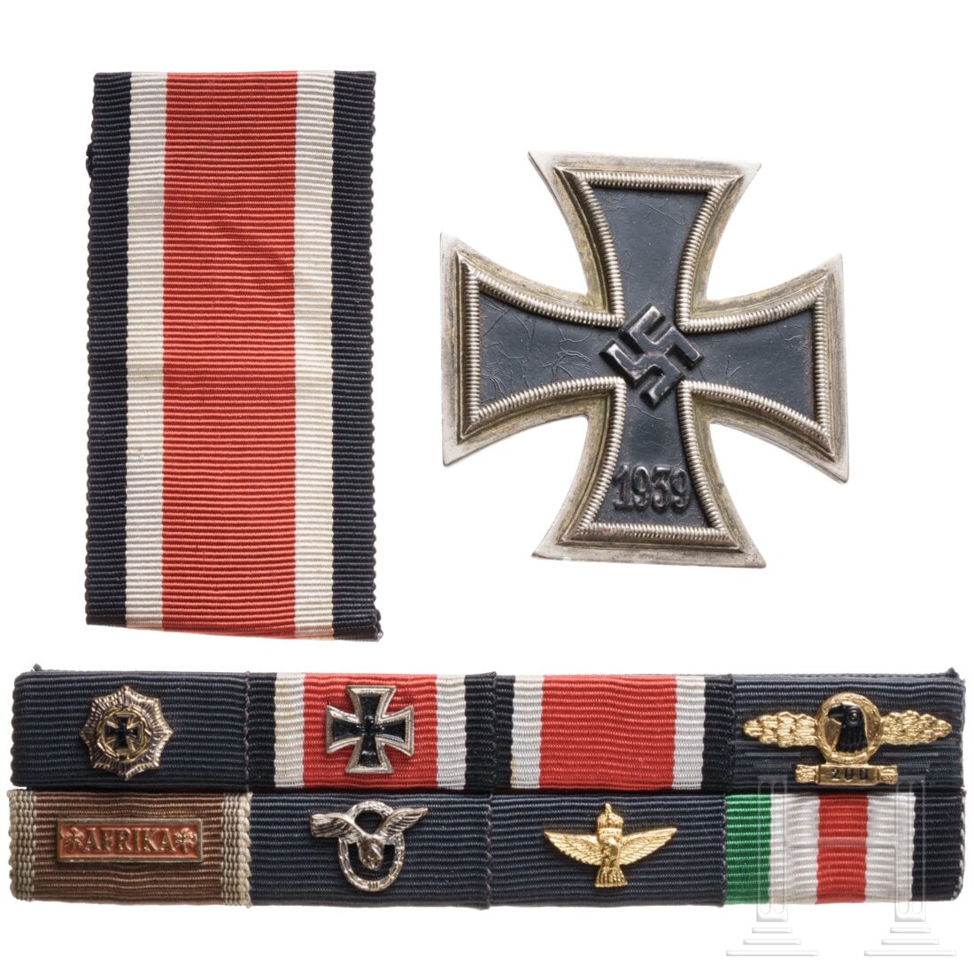 An Iron Cross 1st Class 1939 with ribbon bar of a German Cross in Gold bearer (Africa): An Iron Cross 1st Class 1939 with ribbon bar of a German Cross in Gold bearer (Africa)Kleiner Nachlass eines Trägers des Deutschen Kreuzes in Gold der Luftwaffe, welcher in Afrika diente. Eisernes Kr