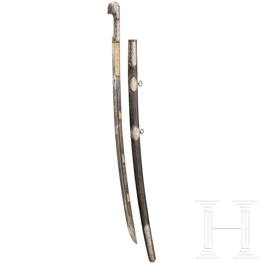 A shashka, Ottoman Empire, 2nd half of the 19th century: A shashka, Ottoman Empire, 2nd half of the 19th centuryLeicht gekrümmte, mehrfach gekehlte Rückenklinge mit goldtauschiertem Floraldekor, etwas fleckig. Silbertauschierter Griff aus Eisen. Lederbezo