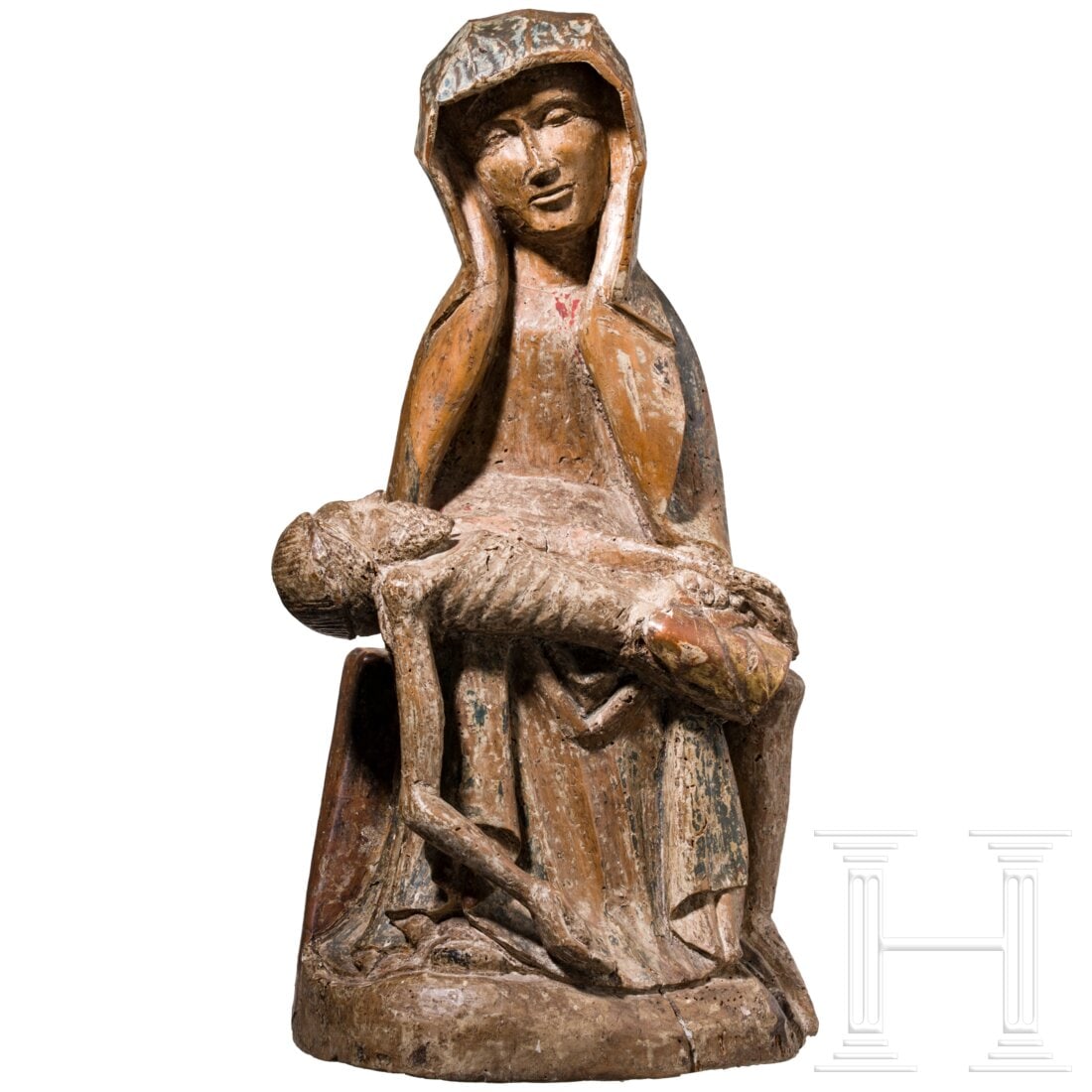 An Austrian pietà, circa 1420: An Austrian pietà, circa 1420Dreiviertelplastisch aus Hartholz geschnitztes Vesperbild mit Resten von Originalfassung und Detailvergoldung. In einen weiten Mantel mit scharfkantig ausfallenden Falten