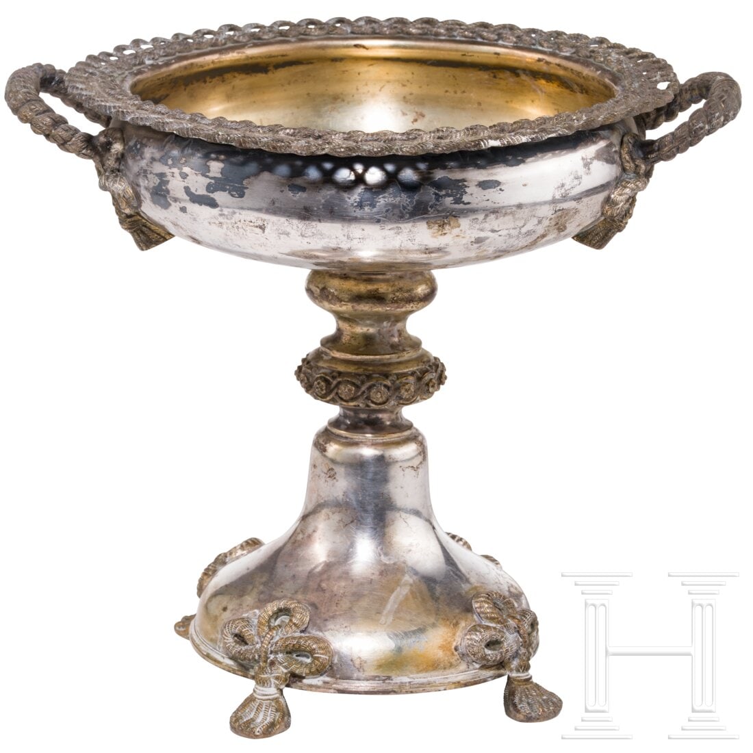 A silver partial-gilt centerpiece, Gebrüder Friedländer Berlin, mid of the 19th century: A silver partial-gilt centerpiece, Gebrüder Friedländer Berlin, mid of the 19th centurySilber, Reste einer Vergoldung. Auf vier Seilfüßen, runde, gewölbte Plinthe in einen Schaft mit zwei Nodi ü