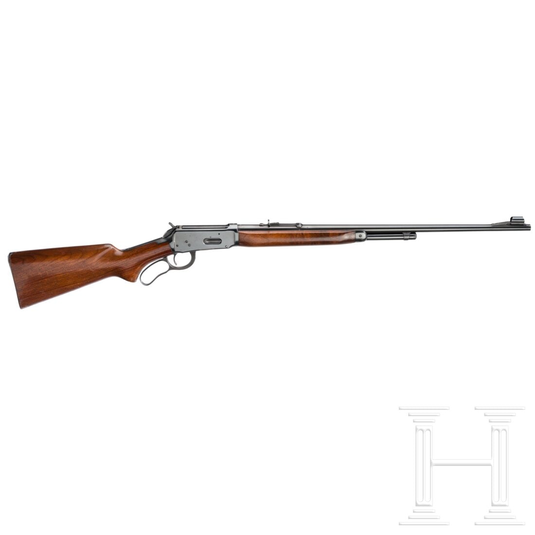A Winchester Mod. 64: A Winchester Mod. 64Cal. .30-30Win, SN. 1936312, nummerngleich, runder, blanker Lauf mit Kornschutz, Länge 24''. Kurzes Röhrenmagazin. Auf dem Lauf Firmierung, Modell- und Kaliberbezeichnung. Schwar