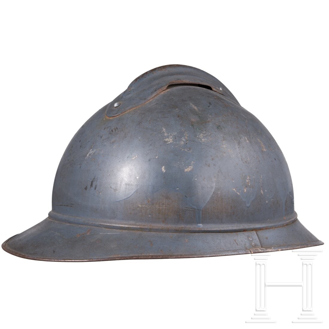 An italian steel helmet "Adrian" M 15, french made: An italian steel helmet "Adrian" M 15, french madeHelm aus der 1. in Frankreich gefertigten Serie, mit dem bläulichen französischen Anstrich und ohne Befestigungslöcher für das Emblem, angesetztem