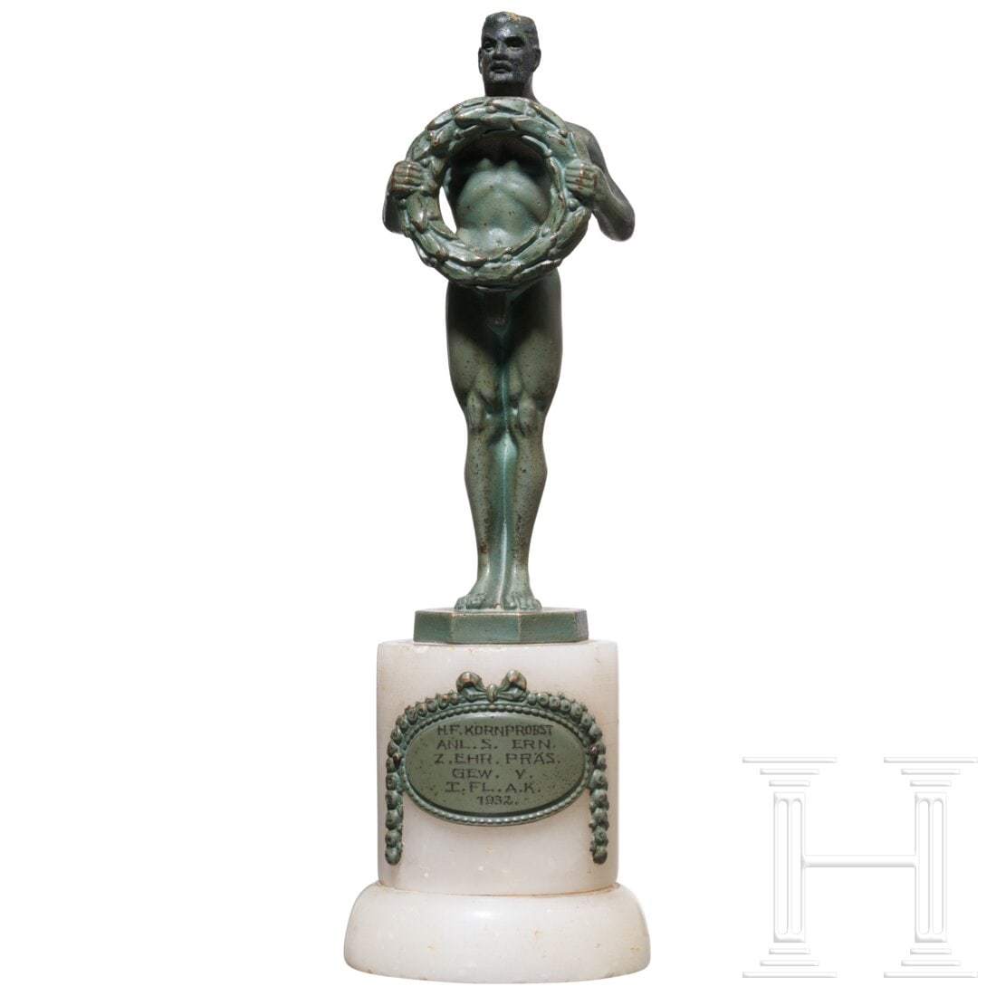 A bronze sculpture “Athlete with Laurel Wreath??, dated 1932: A bronze sculpture “Athlete with Laurel Wreath”, dated 1932Grün patinierte Bronze-Figur auf weißem, rundem Marmorsockel, frontseitig ein gravierter Bronzeschild mit der Inschrift "H.F. KORNP