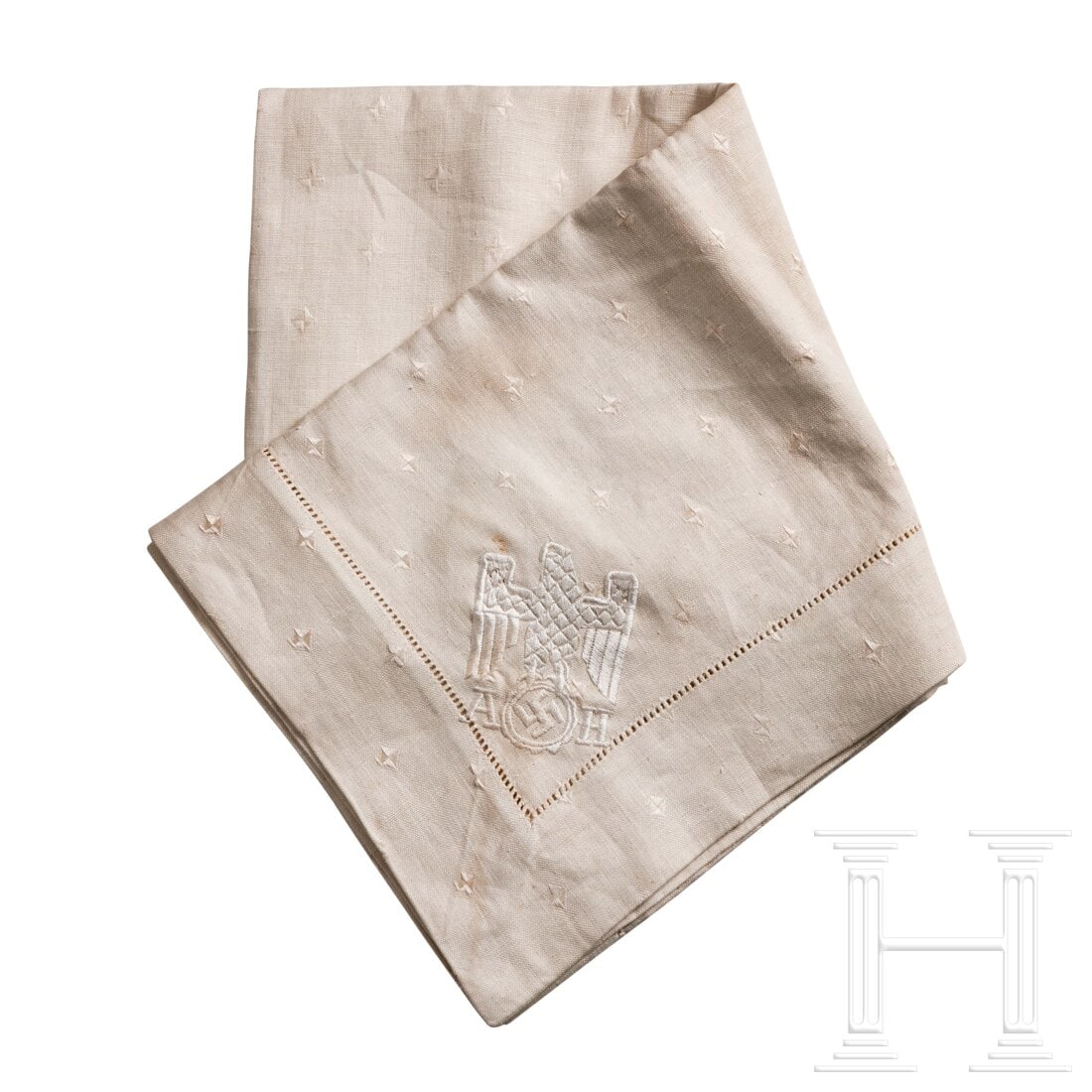 Adolf Hitler - a Small Table Cover from his Personal Service: Adolf Hitler - a Small Table Cover from his Personal ServiceWhite linen table cover, square with formal pattern of geometric diamond-shaped design, at one corner a single white machine-embroidered eag