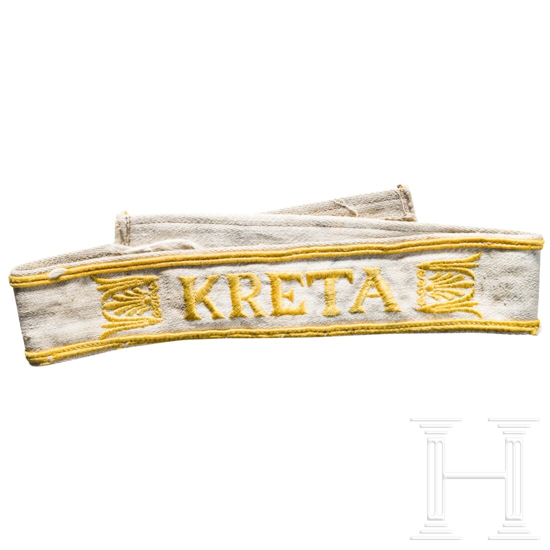 A cuff title "Kreta" (1 of 2)