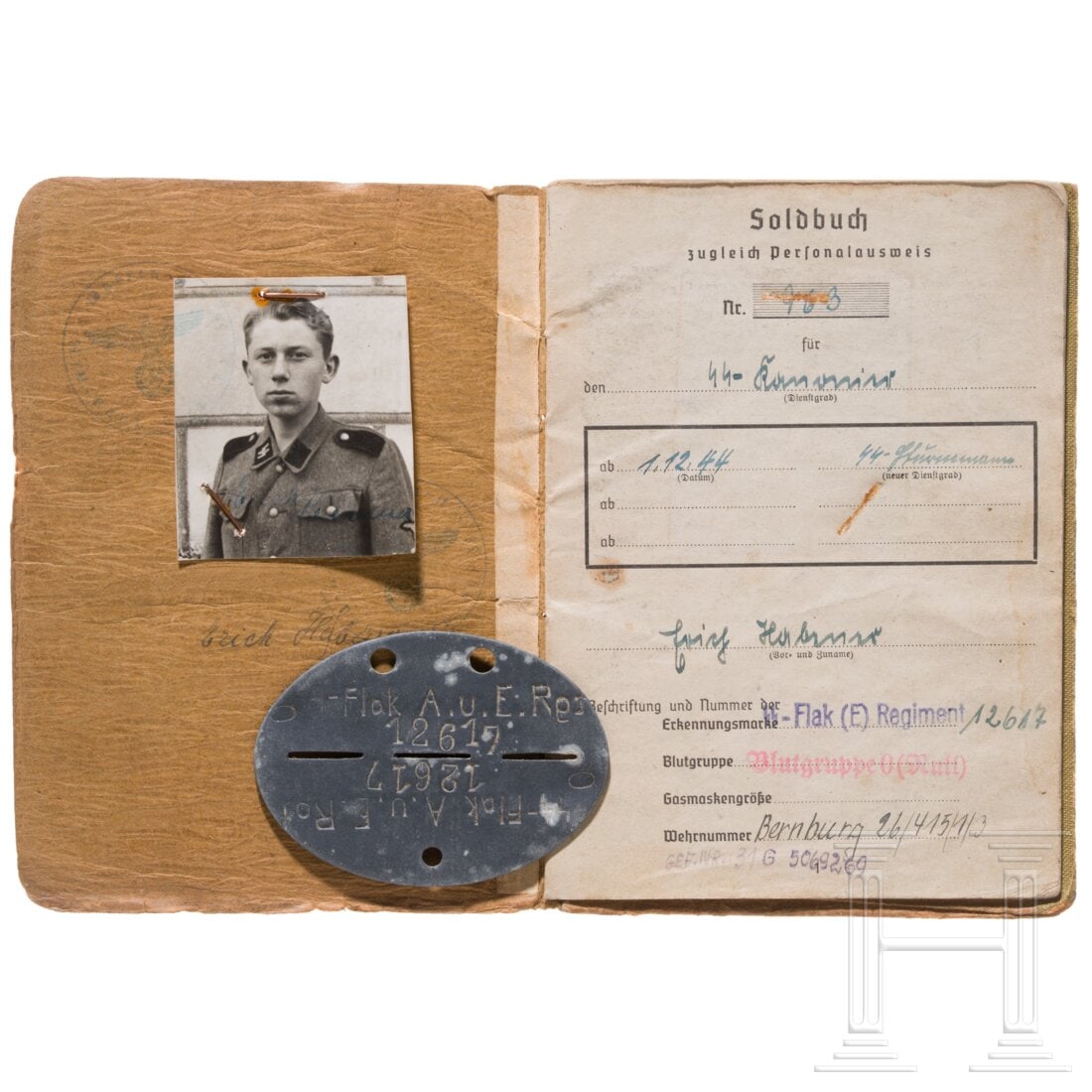A pay book and dog tag of a Sturmmann in the 17. SS-Panzergrenadier-Division "Götz von (1 of 3)