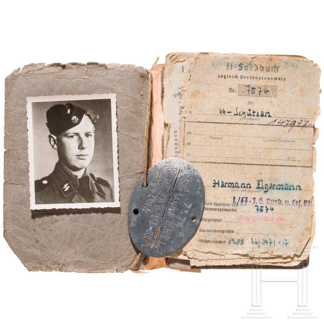An SS pay book and dog tag for a Schütze (1 of 3)